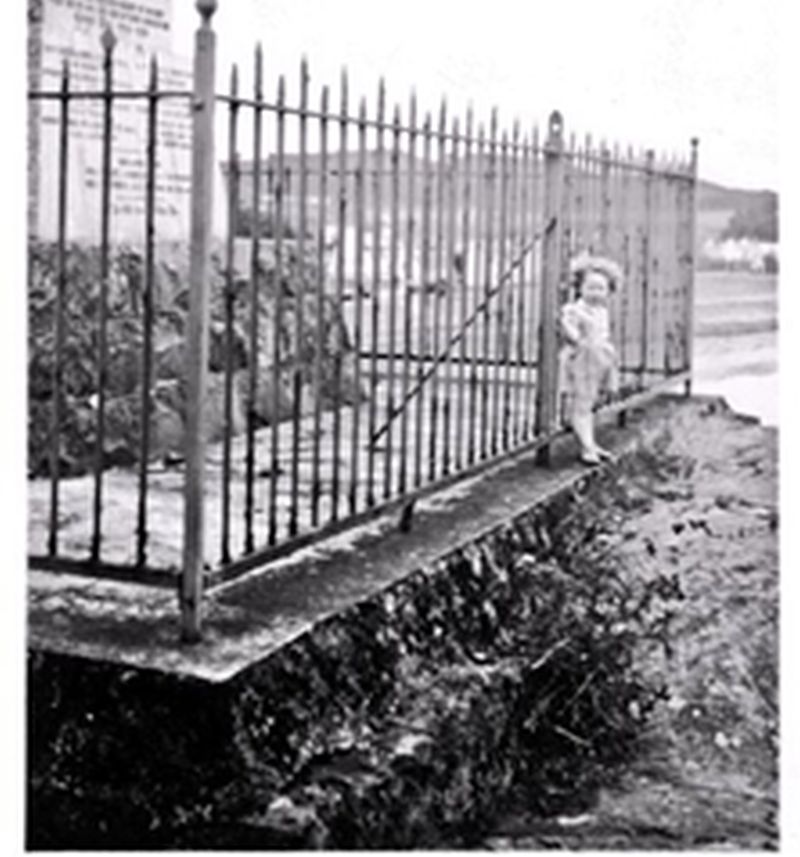 Circa 1950. Railings around the war memorial, the little girl is Ruth Soper.