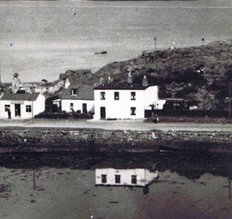 Circa 1960's. Loch Carron Handloom Weavers with ruin of Urquhart's House behind Fuchsia Cottage and Coille Bhurich.