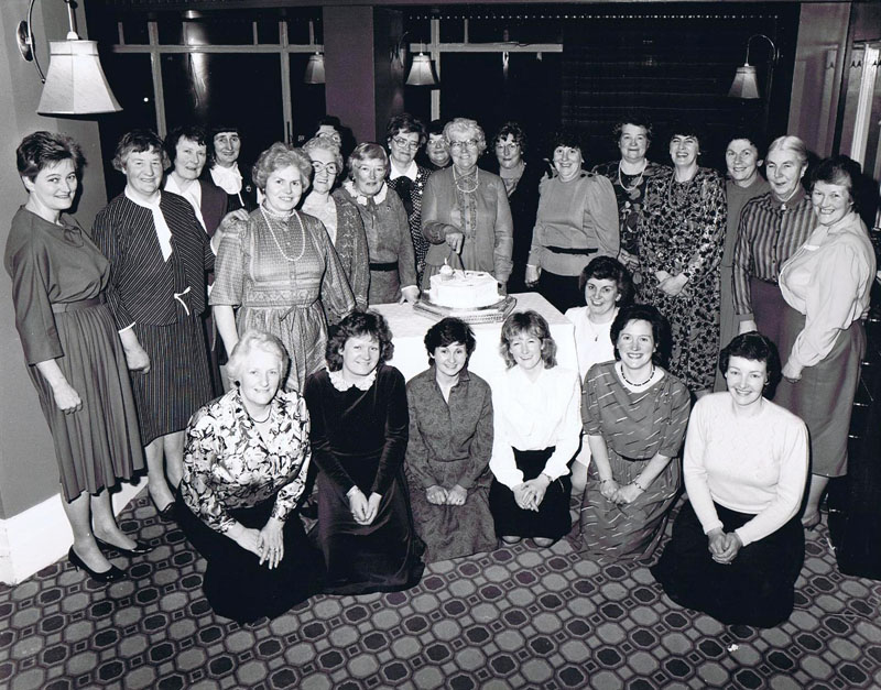 1986 - Kyleakin SWRI, Lochalsh Hotel -
Standing, left to right:  Ann Wilson, Katie Robertson, Clodagh MacKenzie, Annie Finlayson, Katie MacLeod, Jean Downie, Morag Macrae, Dorothy Johnston, Joan Macrae, Eileen Scott, Annie Grant (cutting the cake), Zena Campbell, Jenny MacKenzie, Cathie Reid, Kate Ann MacPherson, Sheena Fulton, Flo Reid and Mary Robertson
Kneeling, left to right:  Joyce Hogarth, Annie Gough, Tia MacLean, Caroline Clouston, Mary Reid, Catherine Grant and Morag Morrison.