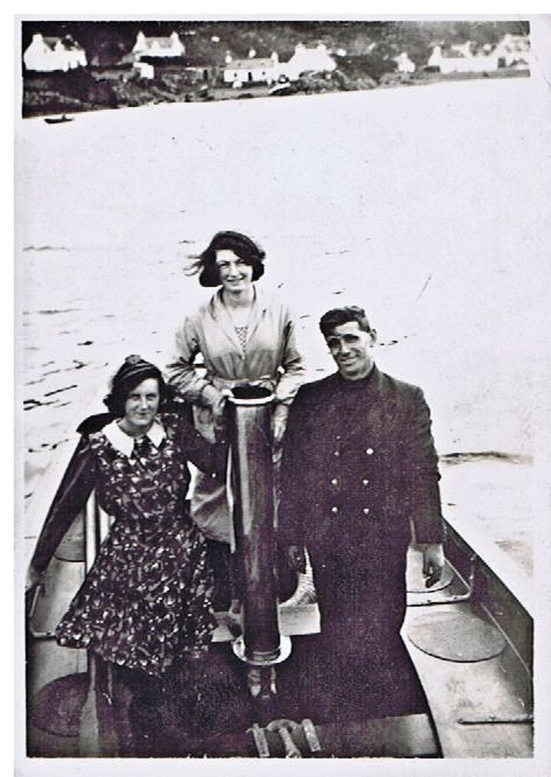 Left to right:  Isa Reid, Agnes Cameron on a launch (possibly tender to the Glen Strathallan which belonged to a Mr Cubbins and anchored in Loch Na Beiste) on the Obbe with uniformed man