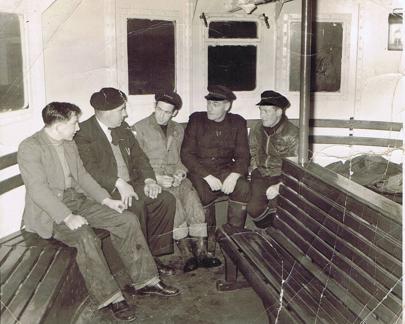 Circa 1960 - CSPCO Ferry crew in Passenger Saloon:
Left to right:  Peter Matheson (Waterloo), Calum (Bhan - Broadford) MacLeod, Dave Robertson, Alistair Finlayson and Angus MacPherson (Speedy)