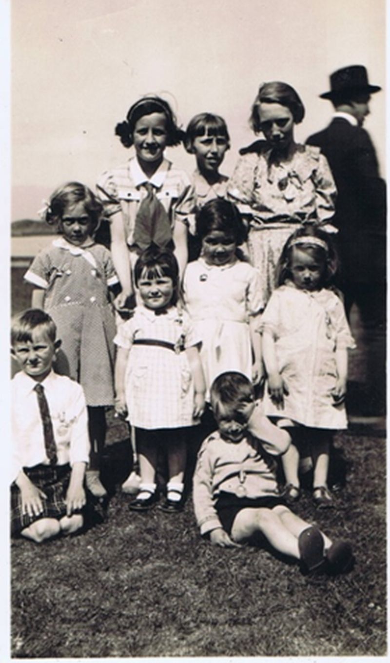 Circa 1937 - back row Mary Ann Robertson (Nan), Mairi Maciver and Nina Maciver.
Middle row:  Ethel Iley, Ann Grigor, Mary Iley and Ethel Robertson.
Front row - kneeling:  John MacLean. 
Sitting:  John Robertson.